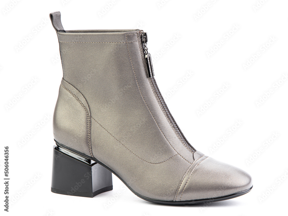 Women's autumn ankle grey leather boots with zip and average heels, isolated white background. Right side view. Fashion shoes.