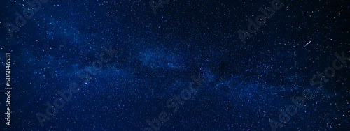 Panorama of the night starry sky on the background of the Milky Way with many colorful shining stars