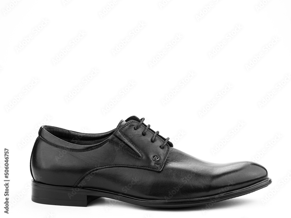A pair of classic leather elegant men's shoes isolated white background. Groom's stylish black shoes. Isolated object close up on white background.