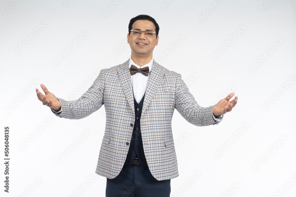 Brunette man looks at camera. Guy with eyeglasses. Brunette man smiles with his arms outstretched. Man model posing on studio isolated on white. Successful cheerful male. Portrait of male brunette. Brunette man looks at camera. Guy with eyeglasses. Brunette man smiles with his arms outstretched. Man model posing on studio isolated on white. Successful cheerful male. Portrait of male brunette.