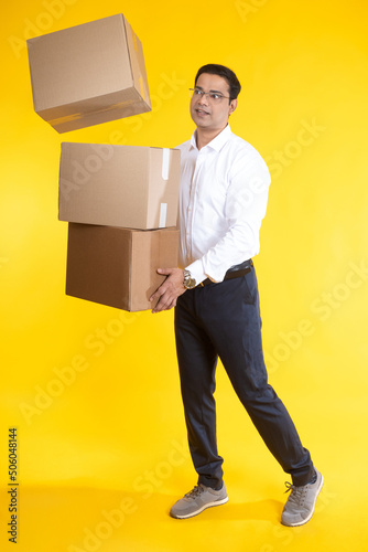 Businessman with boxes. Bus...
