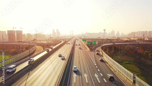 aerial view of traffic on elevated expressway in hangzhou qianjiang centry city at sunset
 photo