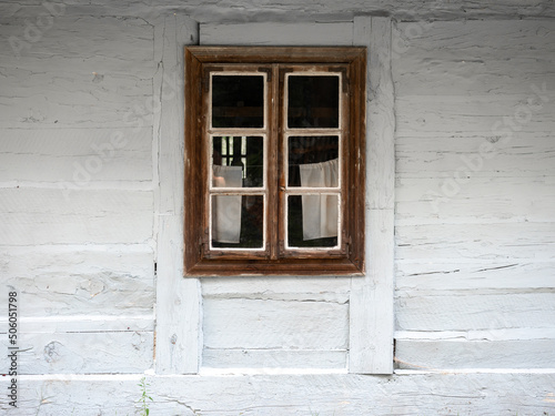 A window in a white wooden hut  Traditional wooden hut  Wooden traditional window  Poland