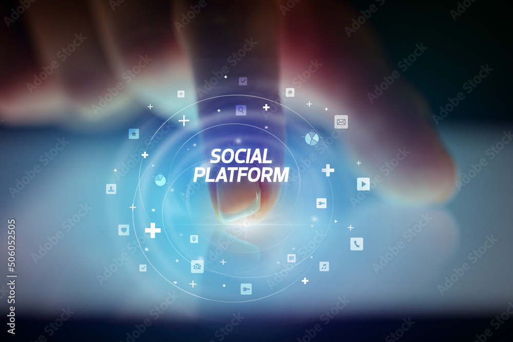 Finger touching tablet with social media icons concept Finger touching tablet with social media icons concept