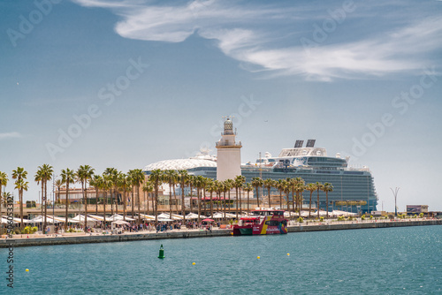 Panoramic view of the port of Malaga. In background Wonder of the Seas docked, the largest cruise ship in the world, owned and operated by Royal Caribbean International.