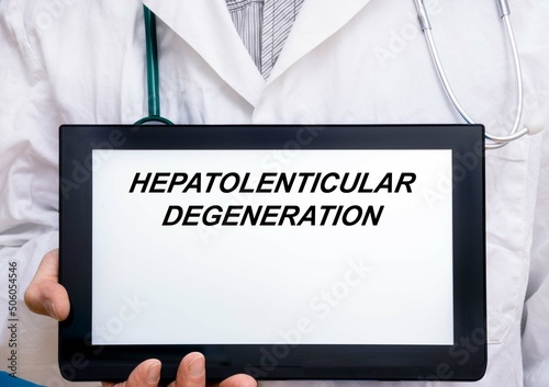 Hepatolenticular Degeneration.  Doctor with rare or orphan disease text on tablet screen Hepatolenticular Degeneration photo