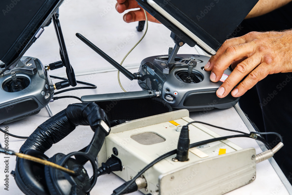 Quadcopter control process. A hand on a large control panel. Equipment for professional flights. Close-up. Unrecognizable person. selective focus Quadcopter control process. A hand on a large control panel. Equipment for professional flights. Close-up. Unrecognizable person. selective focus
