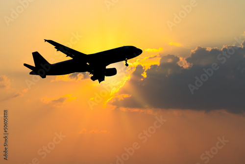 Silhouette of Airplane in the sky.