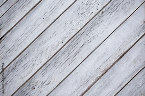 Background of wooden light gray vintage boards as abstract texture copy space