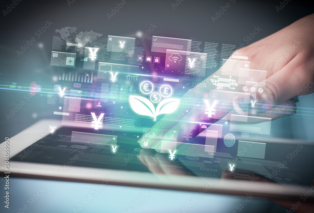Close-up of a hand using tablet, currency concept Close-up of a hand using tablet, currency concept