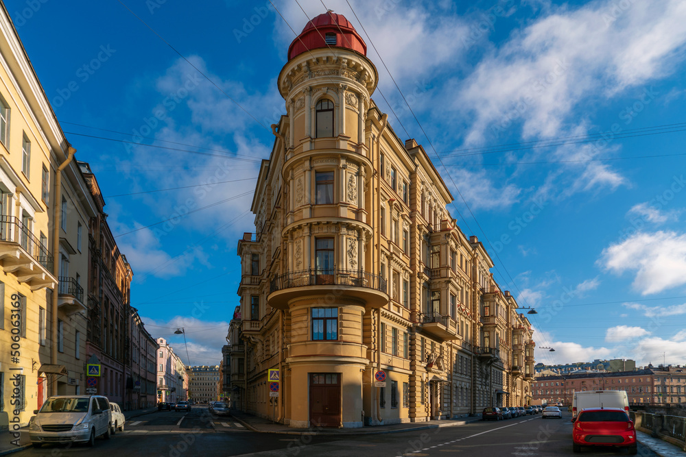 Residential house of the late nineteenth century on the embankment of the Griboyedov Canal on a sunny day, St. Petersburg, Russia