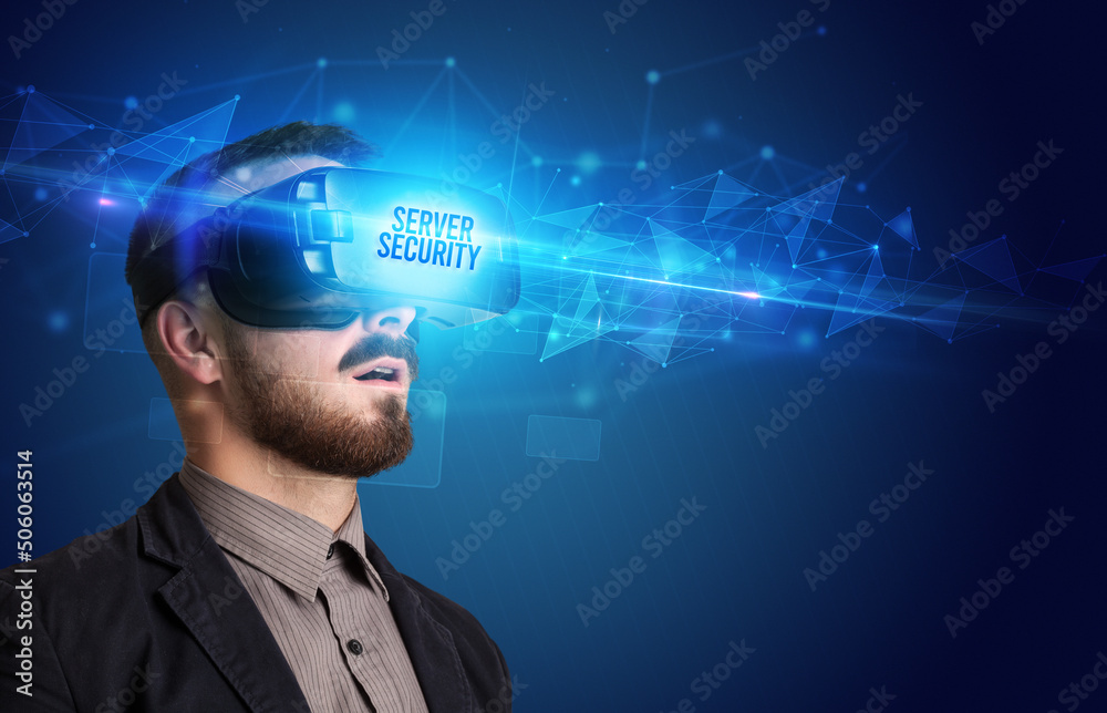 Businessman looking through Virtual Reality glasses, virtual security concept Businessman looking through Virtual Reality glasses, virtual security concept