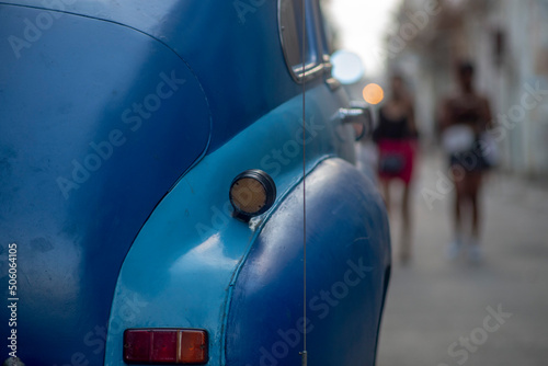 Photography Retro car details on a city street. American cars in Cuba