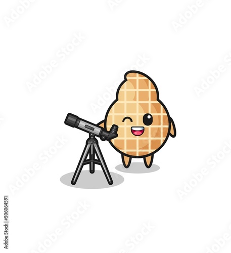 Foto peanut astronomer mascot with a modern telescope
