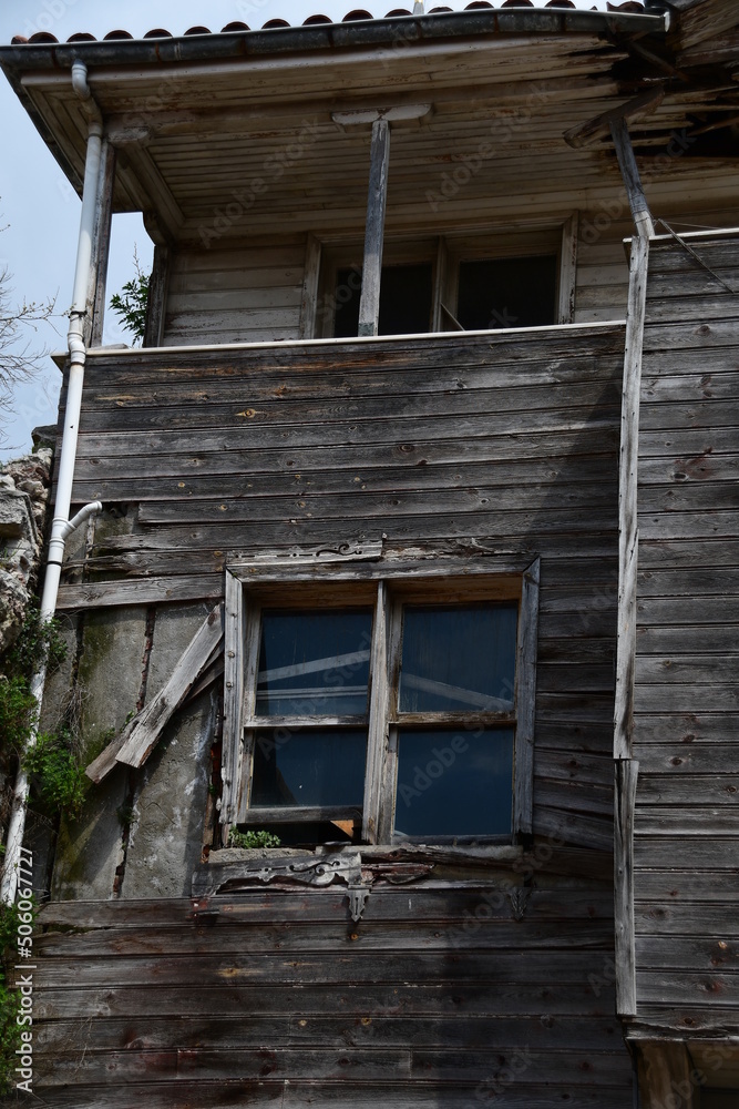 Old destroyed house made of wooden boards. House of gray boards from time to time. Old destroyed house made of wooden boards. House of gray boards from time to time.