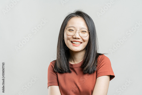 Portrait of a Korean girl on a gray background.