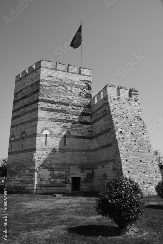 Cheron white photography. Old stone tower with Turkish flag. April 11, 2022. Istanbul, Turkey.