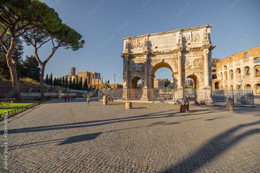 View on Arch of Constantine near Colosseum in Rome. Traveling Italian landmarks concept. Idea of tourist places and attractions