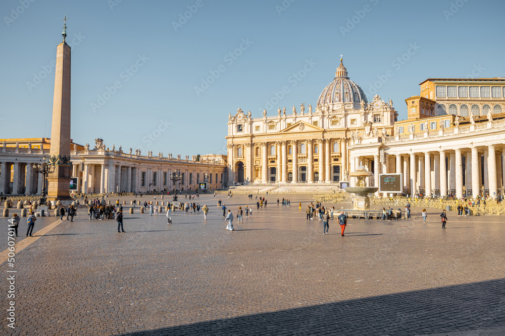 Saint Peter's Square with Vaticano Obelisk and church in Rome on sunny day. Concept of religious landmarks and travel Italy