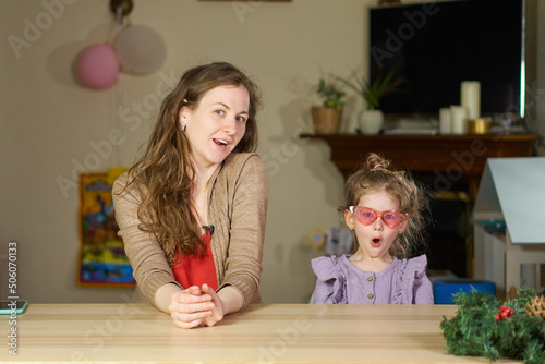 surprise. Woman surprise and girl shock. Happy woman and child have fun. Portrait of smile caucasian mom and girl. Cute little girl hug young mom, showing love and affection