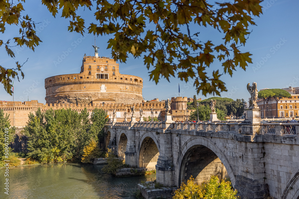 Landscape of Tiber river and Castle of the Holy Angel in Rome on sunny autumn day. Traveling Italy concept. Idea of visiting famous italian landmarks