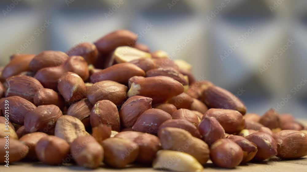 Roasted peanuts on a rotating surface close-up. Highly detailed video. Roasted peanuts on a rotating surface close-up. Highly detailed video.