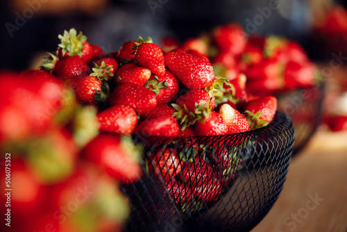 bright tasty juicy strawberries in a black plate