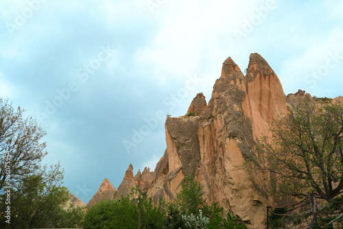 Cappadocia Rock Landscape , lower angle and selective focus view of Fairy Chimney made by rock-hewn sculpted by erosion in the Cappadocia Goreme Valley