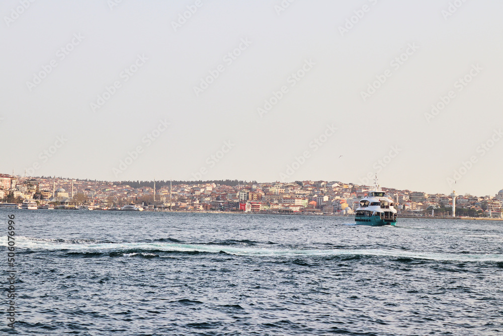 Selective focus blue sea and blurred city and ferry on Bosphorus Istanbul city Selective focus blue sea and blurred city and ferry on Bosphorus Istanbul city