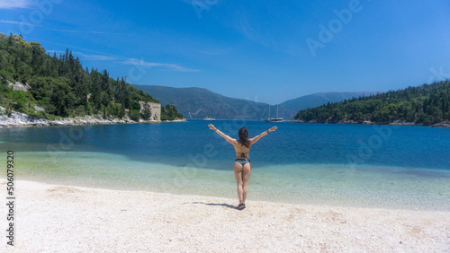 Beautiful sensual young girl in bikini. Crystal blue water. Pacific blue. Mediterranean beach. bikini relax at tropical beach. Sexy model at ocean coast bay.