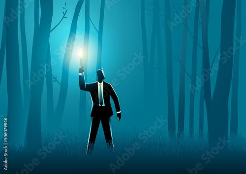 Businessman walking with torch in the dark woods