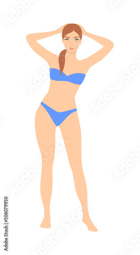 Beautiful young woman in a blue bikini on a white background
