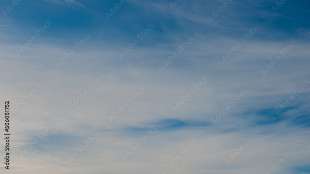 Blurred white clouds on blue sky..