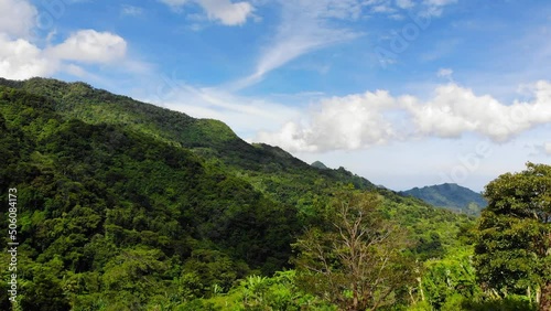 A drone footage from tropical highlands of Philippines, on a bright, sunny day. Shot at the heights of Mount Talinis (Valencia, Negros Oriental, Central Visayas).