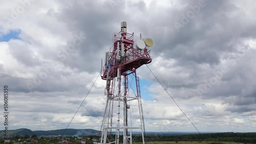 Aerial view of telecommunications cell phone tower with wireless communication antennas for network signal transmission