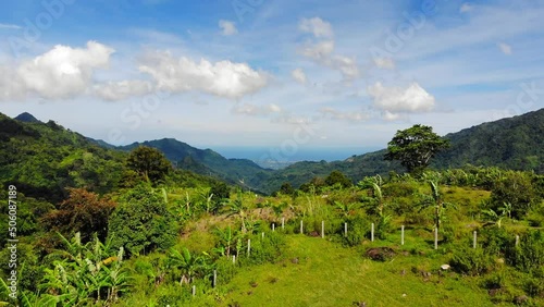 A drone footage from tropical highlands of Philippines, on a bright, sunny day. Shot at the heights of Mount Talinis (Valencia, Negros Oriental, Central Visayas).