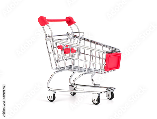 Empty grocery toy shopping cart with red handle isolated on white background, suitable for marketing and shopping product advertisement.