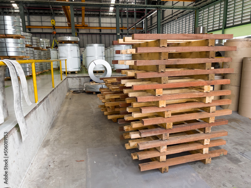 White pallets in the warehouse. roll steel Background