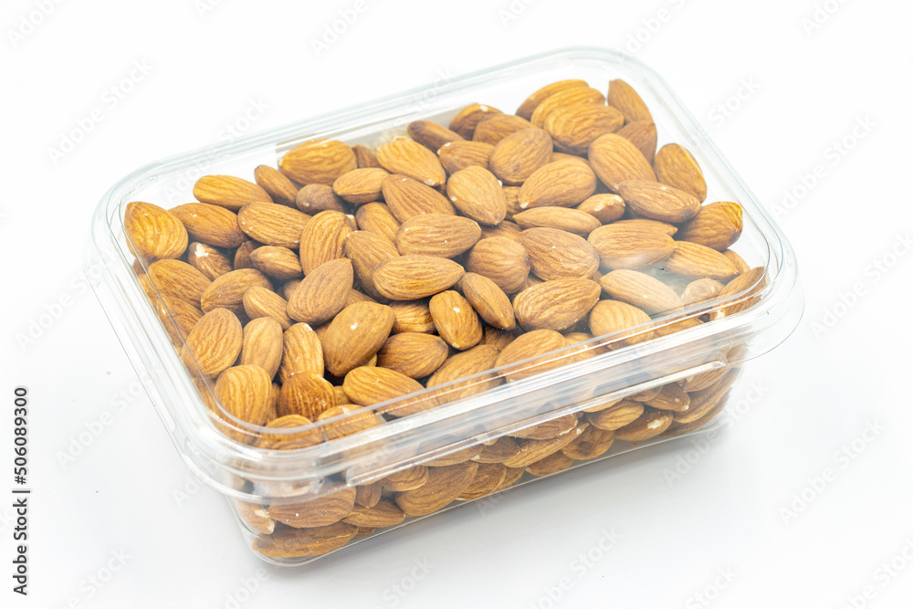 Almond nuts in package isolated on white background. Organic nuts. close up Almond nuts in package isolated on white background. Organic nuts. close up