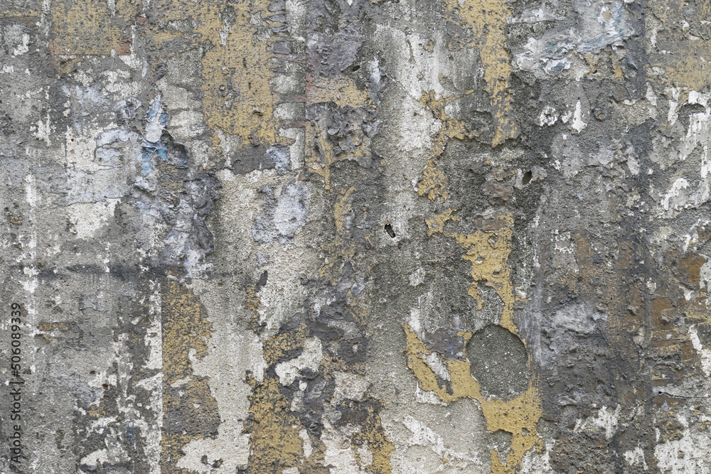 Fototapeta premium old wall textured and damaged with shades of gray, white and gold color, the work of time on the texture of an old wall, textured wall background
