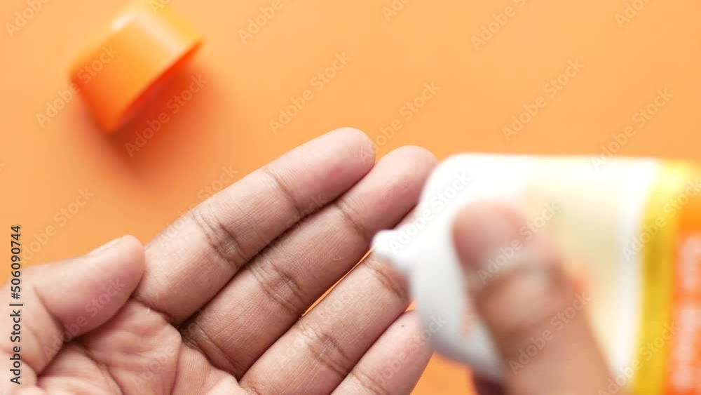 applying sunscreen cream on hand close up applying sunscreen cream on hand close up