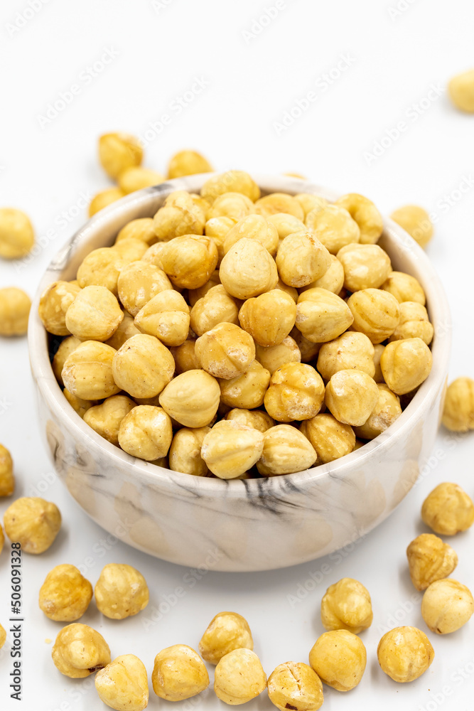 Roasted hazelnut nut isolated on white background. Organic nuts. close up