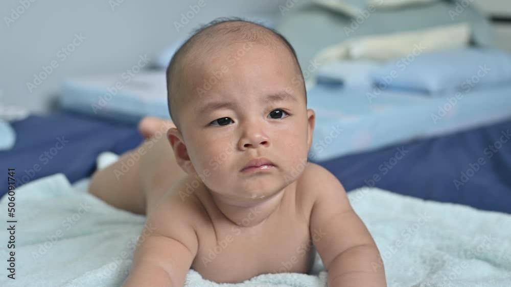 Asian baby newborn playing on bedroom, kid funny cute lovely, Baby safe care healthy concept Asian baby newborn playing on bedroom, kid funny cute lovely, Baby safe care healthy concept