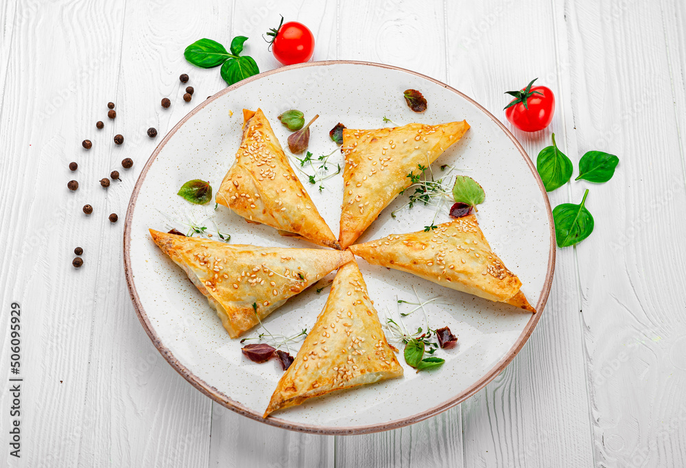 Fresh pies with meat and sesame seeds