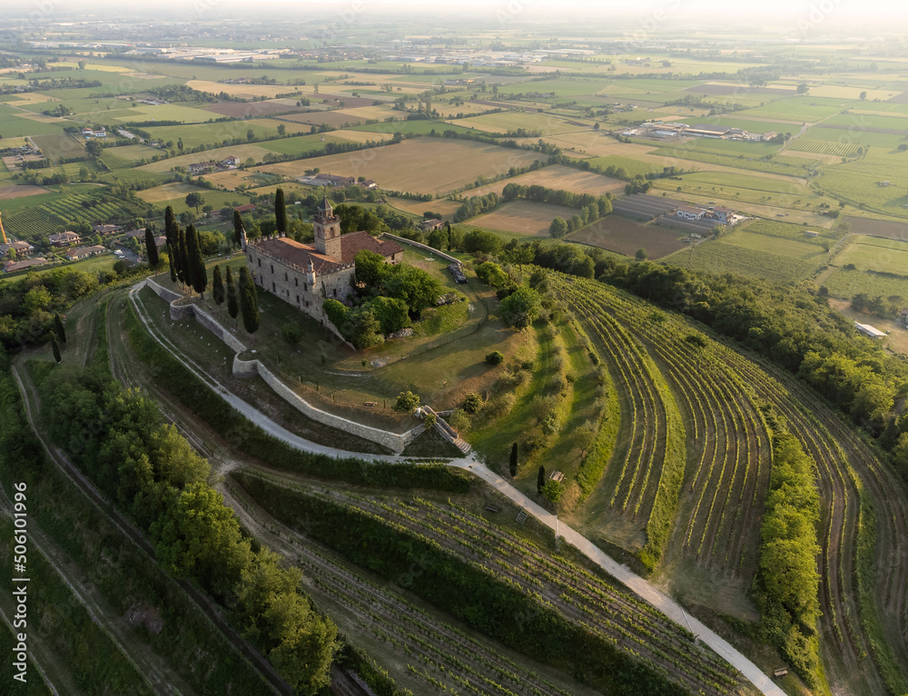 Aerial footage view from the drone of a ancient fortress built on a green hill