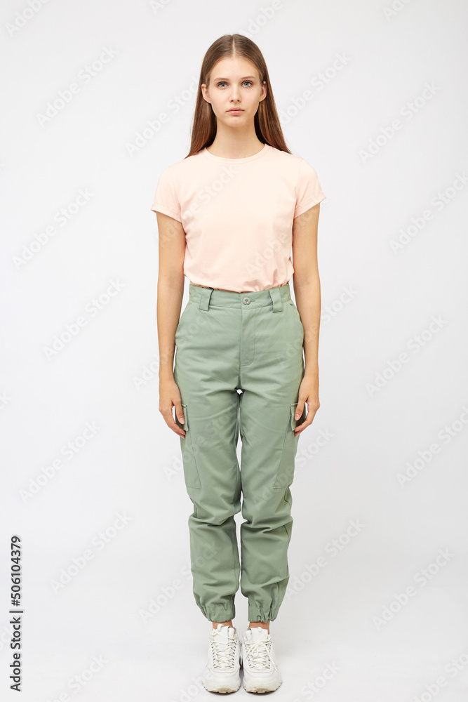 girl in beige cargo pants and t-shirt