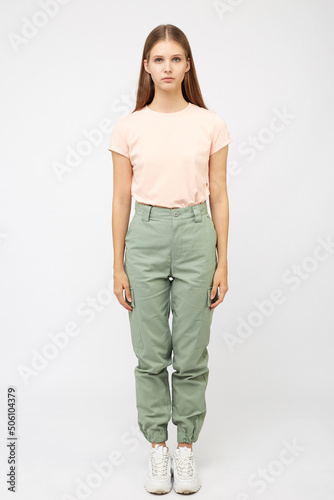 girl in beige cargo pants and t-shirt