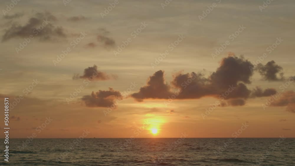 golden sky in sunset above the ocean video 4K.Nature video High quality footage. .Scene of Colorful romantic sky sunset with orange color of the sky background. golden sky in sunset above the ocean video 4K.Nature video High quality footage. .Scene of Colorful romantic sky sunset with orange color of the sky background.