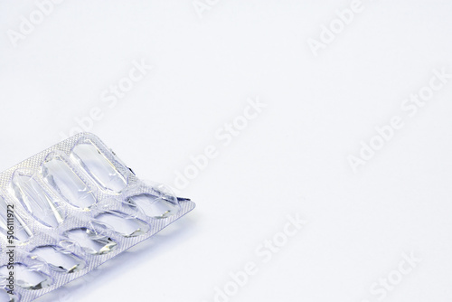 Empty pack of pills isolated on white background. Empty pill package
