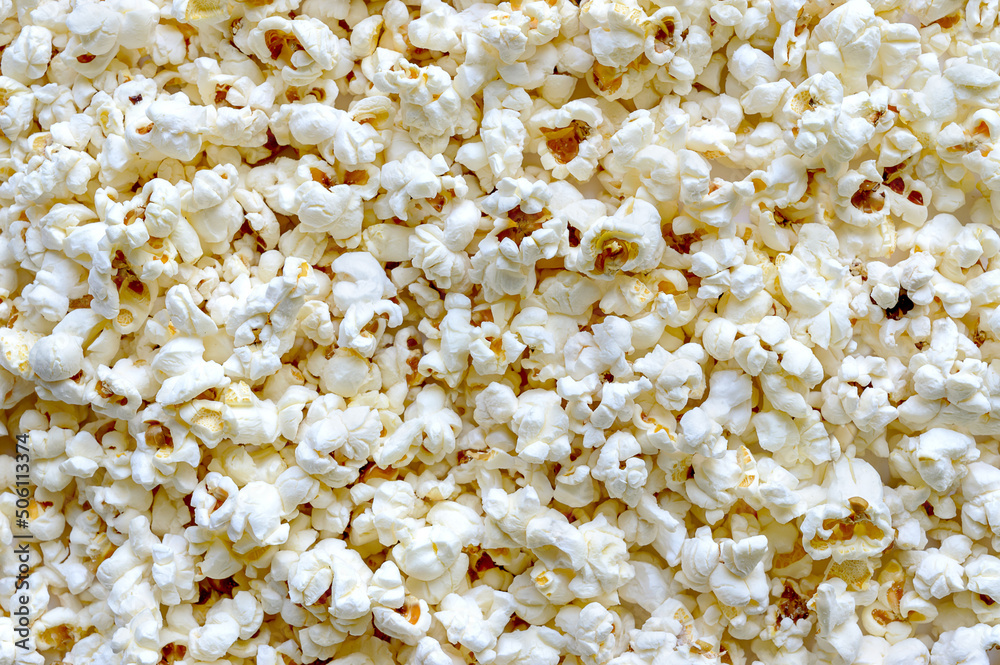 Popcorn texture background. Top view. Snacks and food for a movie Popcorn texture background. Top view. Snacks and food for a movie